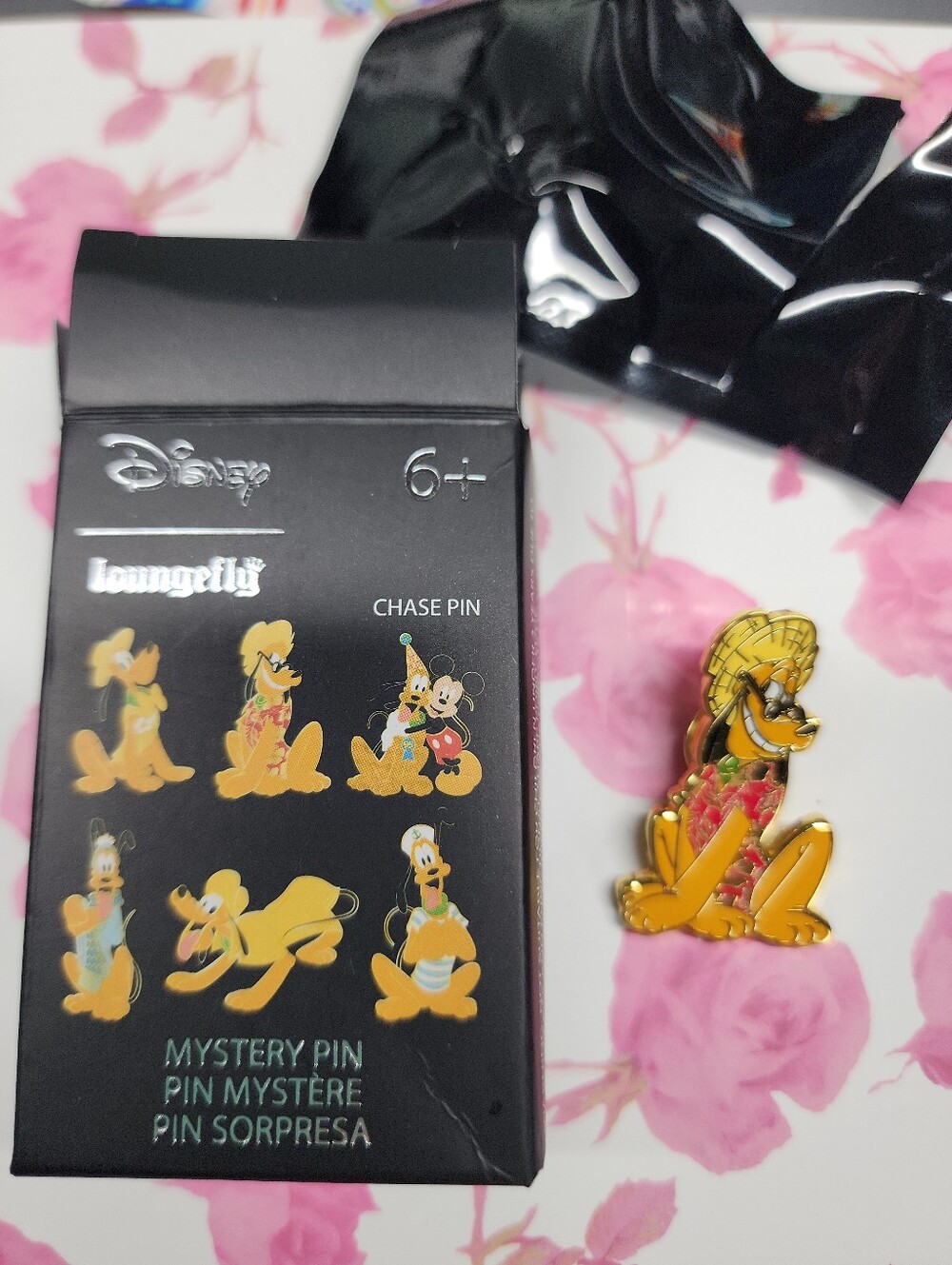 Loungefly mystery pin Pluto wearing a straw hat.